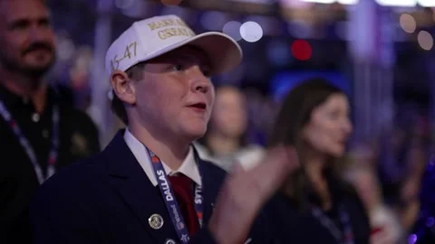 A young delegate in a white cap listens to the speeches, RNC Dallas 2026 Stock Footage 345271609
