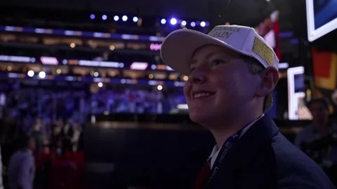 A young delegate in a white cap smiles in the crowd, RNC Dallas 2026 Stock Footage 345274879