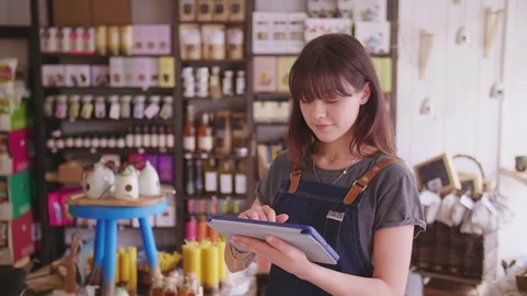 Young Deli Owner Using Digital Tablet In Delicatessen Stock Footage 79657884