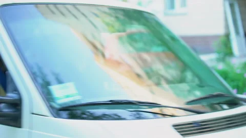 Young delivery man in van holding parcel showing thumbs up, express shipment Stock Footage 91244697