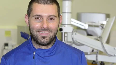 Young dentist smiling in a break from working a laboratory Video stock 59940017