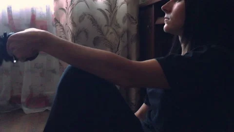 Young depressive woman trying to commit suicide with gun. The concept of social  Stock-Footage 200775072