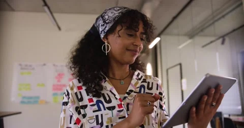 Young desginer working on tablet computer	 Stock Footage 143465458