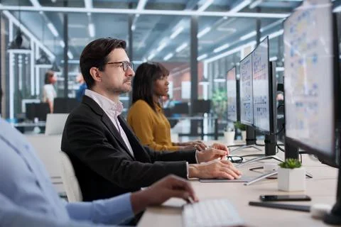 Young Designer And Developer Collaborating On App Interface Design. People Wo Stock Photos