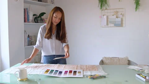 Young designer comparing fabrics and colors. Stock Footage 130595109