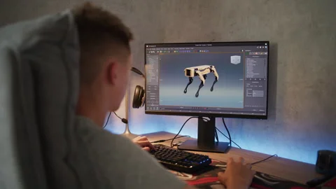 Young designer creates 3D model and animation of the robot dog on computer Stock Footage 281931036
