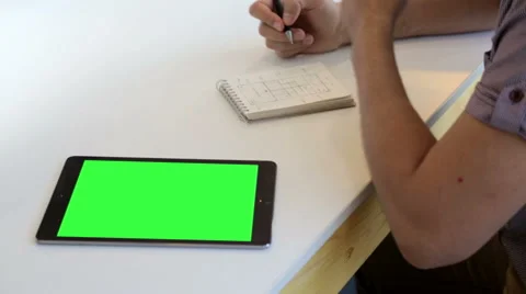 Young designer drawing web design with green screen tablet Stock Footage 62802527