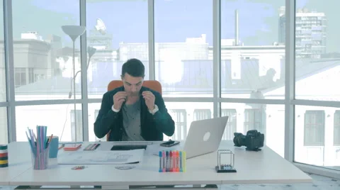 Young designer at his workplace developing a real estate mobile phone Video stock 68169808