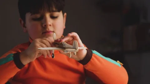 A young designer models an airplane Stock Footage 87569108