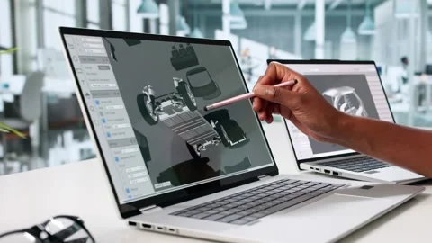 Young Designer Using CAD Software To Render Car Design On Laptop Stock Footage 312469281