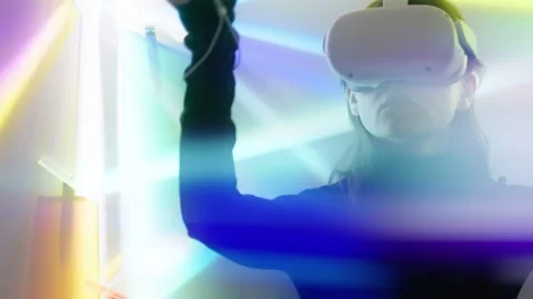 Young designer woman with augmented virtual reality glasses designing future art Stock Footage 242092513