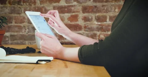 Young designer working on a creative project using the tablet Stock Footage 62240413