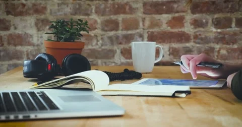 Young designer working on a creative project using the tablet Stock Footage 62240481