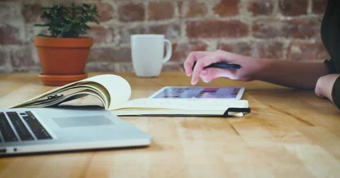 Young designer working on a creative project using the tablet Stock Footage 62240557