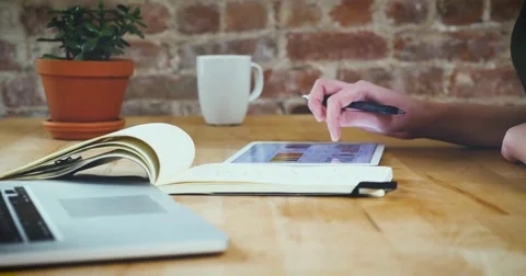 Young designer working on a creative project using the tablet Stock Footage 62240619