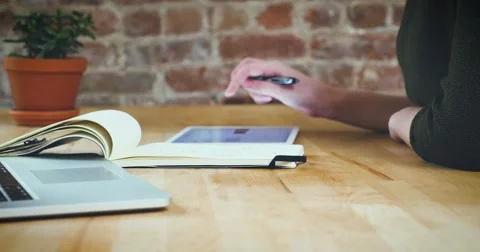 Young designer working on a creative project using the tablet Stock Footage 62240714