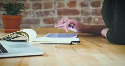 Young designer working on a creative project using the tablet Stock Footage 62240723