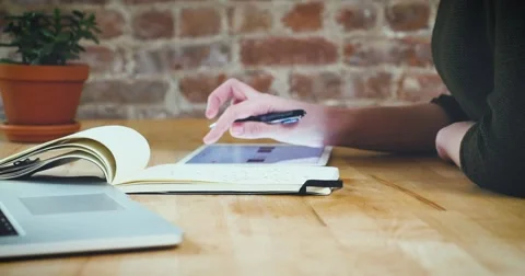 Young designer working on a creative project using the tablet Stock Footage 62240766