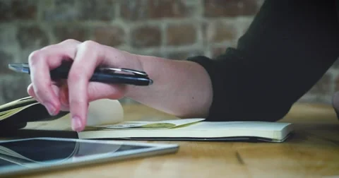 Young designer working on a creative project using the tablet Stock Footage 62240880