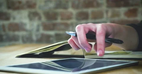 Young designer working on a creative project using the tablet Stock Footage 62240899