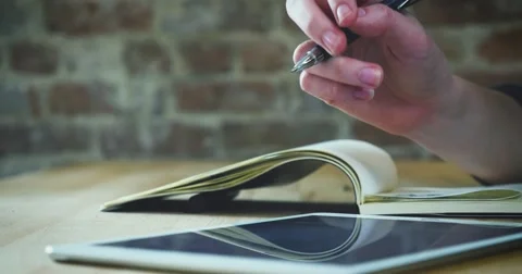 Young designer working on a creative project using the tablet Stock Footage 62240907