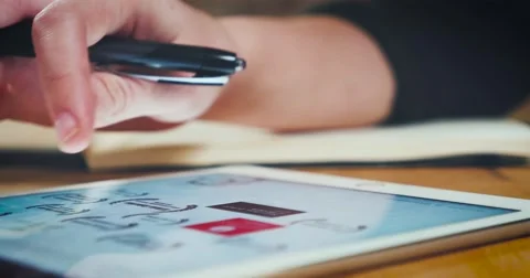 Young designer working on a creative project using the tablet Stock Footage 62241075