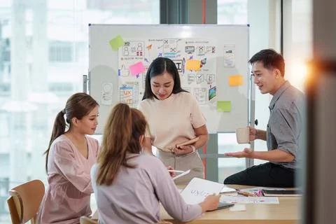 Young developer and ui designer brainstorming interface wireframe design 스톡 사진