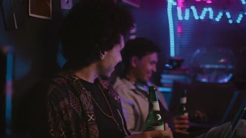 Young Developer Celebrating Success and Clinking Beer Bottle with Friend 스톡 동영상 290876667