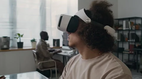 Young Developer in Headset Testing VR Application Using Laptop at Workplace Stock Footage 299232217