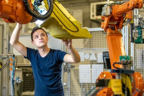 Young developer testing new robot Stock Photos
