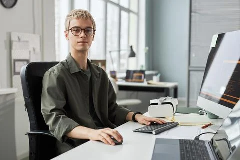 Young developer working on computer in office Stock Photos