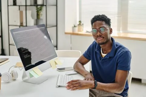 Young developer working at his workplace with computer Stock Photos