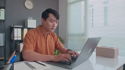 Young Developer Working on Laptop at Office Desk Stock Footage 265067531