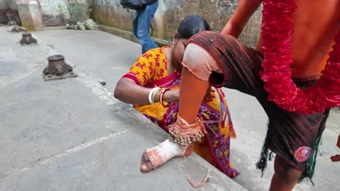 Young devotee covered with orange dressing at Lal Kach, Munshiganj, Bangladesh Stock Footage 310752616