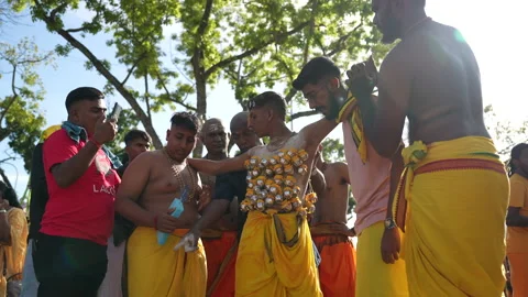 A Young Devotee With Heavily Pierced Front And Back Stock Footage 234038709