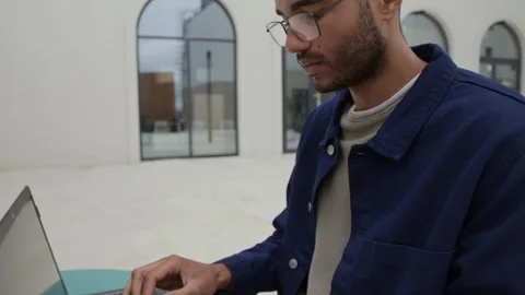 Young Digital Nomad Working in Open Air Cafe Stock Footage 320013692