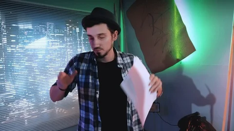 Young director teaching understudies during scene shooting standing against Stock Footage 124331933