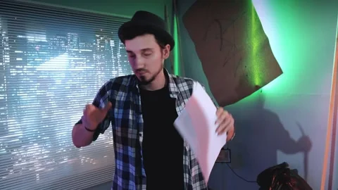 Young director teaching understudies during scene shooting standing against Stock Footage 130660223