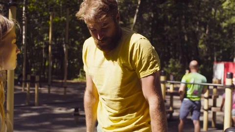 Young disable man doing exercises on the parallel bars Video stock 93811315