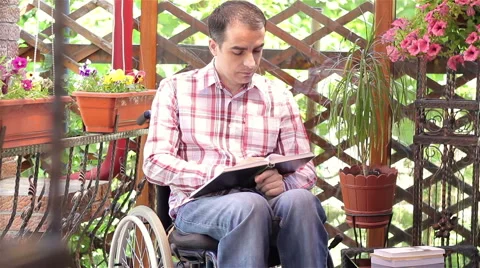 Young disabled man reading book Video stock 50648053
