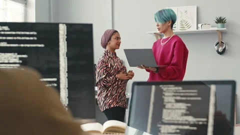 Young Diverse Colleagues Chatting at Programmers Office Video stock 241267543