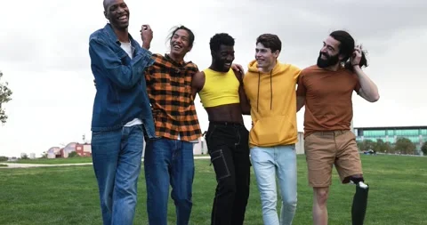 Young diverse men having fun laughing together at city park Stock Footage 192383725