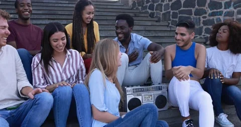 Young diverse people having fun in the city while listening music Stock Footage 158222507