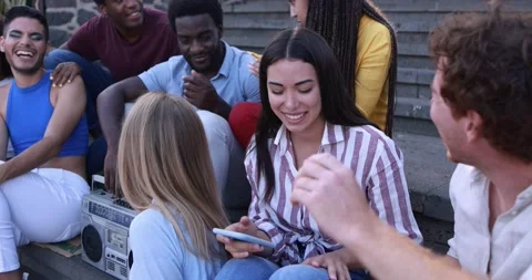 Young diverse people having fun in the city while listening music from boombox Stock Footage 158222933