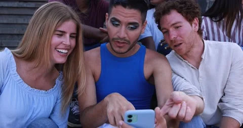 Young diverse people having fun in the city while using mobile phone Video stock 158223617