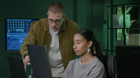 Young Diverse Programmers Teaching Process in Computer Office Stock Footage 292617206
