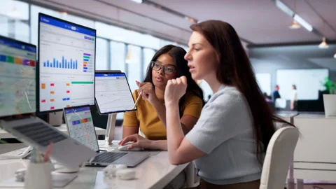 Young Diverse Sales Managers Working Together Using Laptops Stock Footage 340403295