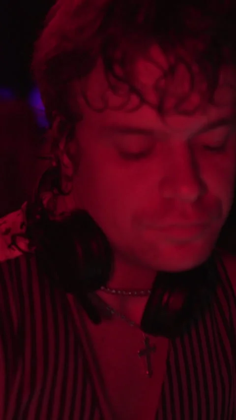 Young DJ Performing Live Under Red Lights in Nightclub 스톡 동영상 337902495