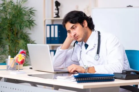 Young doctor cardiologist working in the clinic Stock Photos