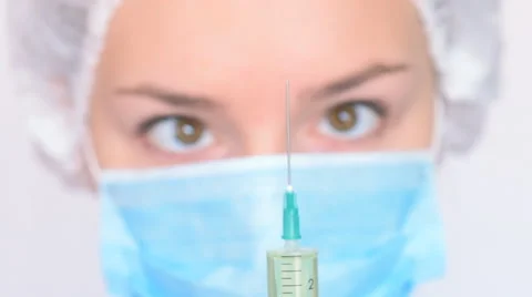 Young doctor getting ready for injection Stock Footage 61512130